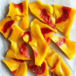 - 2 ripe mangos, peeled and diced - 2 cups strawberries, hulled and sliced - 2 tablespoons honey (or agave syrup for a vegan option) - 1 tablespoon lemon juice - Pinch of salt The ingredients for Tie-Dye Mango Strawberry Fruit Leathers are simple yet vibrant. You need ripe mangos and fresh strawberries for the best taste. The honey adds a touch of sweetness, while lemon juice gives a nice zing. A pinch of salt enhances the flavors too. - Calories per serving: About 50 calories - Breakdown of macronutrients: - Carbohydrates: 12g - Protein: 0.5g - Fat: 0g These fruit leathers are not just tasty; they are also healthy. Mangos and strawberries are rich in vitamins A and C. They also provide fiber, which helps digestion. The natural sugars in the fruits offer a quick energy boost without added sugar. Fruits like these can help improve your skin and boost your immune system. Making your own fruit leather means you control the ingredients. This makes it a great choice for a healthy snack. Check out the Full Recipe for all the steps to make this delicious treat! To start, gather your fruit. You need ripe mangos and fresh strawberries. Peel and dice the mangos. Hull and slice the strawberries. Next, blend these fruits together. In a blender, mix the diced mango, hulled strawberries, honey, lemon juice, and a pinch of salt. Blend until smooth. If you want a tie-dye effect, separate the mixture into two bowls. Now you have a mango puree and a strawberry puree. Layering is key for the tie-dye look. If you used two bowls, that's perfect! Keep one bowl with mango puree and another with strawberry. Use a baking sheet lined with parchment paper. Add spoonfuls of mango puree to one side. Then, add spoonfuls of strawberry puree to the other side. Use a toothpick or spatula to swirl the two mixtures together. This creates a fun tie-dye pattern. Now it's time to dry your fruit leather. Preheat your oven to the lowest setting, around 140°F or 60°C. Place your baking sheet with the fruit mixture in the oven. Let it dry for about 6 to 8 hours. Check on it now and then. Drying times can change based on humidity and your oven. When it’s no longer sticky to the touch and peels away easily from the parchment, it's ready. For the best fruit leather, aim for a thickness of about 1/8 inch. This size helps it dry evenly. If it is too thick, the center will stay sticky. If it is too thin, it may not hold together well. Common pitfalls include not checking the fruit leather often. Drying times can change due to humidity and oven settings. Always check for doneness. The fruit leather should feel dry and peel away easily from the parchment paper. To boost flavor, consider adding spices like cinnamon or ginger. These spices can give your fruit leathers a warm touch. You can also mix in other fruits like bananas or peaches. Adjusting sweetness is simple too. If you prefer a sweeter taste, add more honey or agave syrup. If you want less sweetness, cut back on the sweetener. The natural sweetness of the fruits often shines through, so taste as you go. For blending, a high-speed blender works best. It will puree the fruit smoothly. A food processor can work too, but it may leave some chunks. For drying, use a flat baking sheet lined with parchment paper. This setup prevents sticking. Choose a baking sheet that fits your oven well. {{image_2}} You can mix many fruits for your fruit leathers. Try peaches, apples, or blueberries. Each fruit adds its own taste and color. Mixing fruits creates a fun twist. You could also add herbs or spices to make them special. Mint or basil can add a fresh zing. A touch of cinnamon or ginger can warm up the flavors. For vegan options, simply swap honey for agave syrup. This way, you keep the sweetness without using animal products. The recipe is gluten-free, as it uses only fruit and natural sweeteners. This makes it great for many diets. You can enjoy these treats without worry! Cut the fruit leathers into fun shapes using cookie cutters. Stars, hearts, or animals can make these snacks exciting for kids. You can also roll them up and tie with a string for gifts. Wrapping them in colorful paper adds a nice touch. These ideas make your fruit leathers not just tasty, but fun to share too! To keep your Tie-Dye Mango Strawberry Fruit Leathers fresh, use airtight containers. This prevents air from getting in and drying them out. You should also avoid moisture. If they get wet, they spoil faster. These fruit leathers last up to two weeks at room temperature. Look for signs they have gone bad. If they feel sticky or smell off, it’s time to toss them. Freezing is a great way to keep your fruit leathers longer. To freeze, cut them into strips and stack them with parchment paper in between. This helps them stay separate. When you want to eat them, thaw them in the fridge overnight. You can also leave them out at room temperature for a few hours. Enjoy this tasty treat whenever you like by following these simple steps! The best ways to dry fruit leathers are using an oven or a dehydrator. - Oven drying: Preheat your oven to its lowest setting. Lay the fruit mixture on parchment paper. It usually takes about 6-8 hours. - Dehydrator: This method is more energy-efficient. Set it to 135°F. Drying time is similar, about 6-8 hours. The dehydrator offers more control. It can keep a steady temperature. Yes, you can use frozen fruit. However, it may change the texture and flavor. Frozen fruit often has more water, which can make the leather softer. - Thawing: Best to thaw your fruit in the fridge overnight. This keeps the fruit cool, which helps in blending later. Yes, you can make fruit leathers without sugar. You can use natural sweeteners like honey or agave syrup. - Effects: These alternatives still add sweetness but can change the taste slightly. Fruit itself often has enough natural sweetness to shine. You can tell if the fruit leather is done by looking and touching it. - Visual cues: It should look dry and not sticky. - Touch tests: Gently press the surface. If it's tacky, it needs more time. When it’s no longer sticky, it's ready to cool. For more tasty ideas, check the Full Recipe for Tie-Dye Mango Strawberry Fruit Leathers! Now you know how to make delicious fruit leather at home. We explored the key ingredients, focused on preparation, and discussed drying techniques. I shared tips for texture, flavor, and storage. The variations let you personalize your fruit leather, making it unique and fun. Remember, using the right tools can make a big difference. Enjoy your tasty treat, and let your creativity shine in the kitchen!