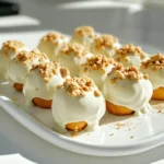 - 1 cup pumpkin puree - 1/2 cup creamy peanut butter - 1/4 cup pure maple syrup - 1 teaspoon vanilla extract - 1 teaspoon pumpkin pie spice - 2 cups rolled oats - 1 cup white chocolate chips - 1/4 cup crushed graham crackers (for topping) - Pinch of salt - 1 cup = 8 fluid ounces - 1/2 cup = 4 fluid ounces - 1/4 cup = 2 fluid ounces - 1 teaspoon = 5 milliliters - Use fresh pumpkin puree for the best taste. Canned puree works too, but check the label for added sugars. - Choose a creamy peanut butter without added sugar or oils. This will keep your bites smooth. - Pure maple syrup gives a rich flavor. Avoid imitation syrup as it lacks depth. - Pick high-quality white chocolate chips for a creamy coating. They should melt evenly and taste great. - For the pumpkin pie spice, look for a blend without fillers. Fresh spices can enhance flavor. - Use rolled oats, not quick oats. Rolled oats give a better texture and bite. - When using graham crackers, crush them just before use for the best crunch. To start, gather all your ingredients. You will need pumpkin puree, peanut butter, maple syrup, vanilla, pumpkin pie spice, rolled oats, white chocolate chips, graham crackers, and salt. This part takes just a few minutes. Make sure you have a large mixing bowl and a baking sheet lined with parchment paper. In your large mixing bowl, combine the following ingredients: - 1 cup pumpkin puree - 1/2 cup creamy peanut butter - 1/4 cup pure maple syrup - 1 teaspoon vanilla extract - 1 teaspoon pumpkin pie spice - Pinch of salt Mix these until smooth. You want everything to blend well. Then, gradually add in the 2 cups of rolled oats. Fold them in gently. Keep mixing until the oats are evenly coated. The mixture should feel thick and sticky. Now, use a small cookie scoop or your hands to form balls. Each ball should be about 1 inch wide. Place them on your lined baking sheet. Next, it's time to melt the white chocolate chips. Place them in a microwave-safe bowl. Heat them in 20-second intervals. Stir after each interval. Keep going until the chocolate is smooth and creamy. Now, take each pumpkin bite and dip it into the melted white chocolate. Make sure to coat each bite fully. After that, return the bites to the baking sheet. While the chocolate is still warm, sprinkle crushed graham crackers on top. This adds a nice crunch. Finally, let the tray chill in the fridge for about 30 minutes. This helps the white chocolate set well. To make your no bake white chocolate pumpkin bites, start with a large bowl. Add pumpkin puree, peanut butter, maple syrup, vanilla, pumpkin pie spice, and salt. Mix these well until smooth. This creates a tasty base. Next, gradually fold in the rolled oats. This helps the mixture thicken. Use a small cookie scoop or your hands to form one-inch balls. Keep them uniform in size for even coating. Place each ball on a parchment-lined tray for easy handling. For the chocolate coating, use white chocolate chips. Melt them carefully in the microwave. Heat in 20-second bursts and stir in between. This keeps the chocolate smooth and creamy. Once melted, dip each pumpkin bite fully into the chocolate. Ensure they are well coated. This adds a sweet layer that pairs well with pumpkin. Return the coated bites to the tray and work quickly while the chocolate is warm. To serve your pumpkin bites, arrange them on a nice plate. You can drizzle some leftover melted white chocolate on top. This adds a lovely touch. For extra flair, sprinkle a bit of pumpkin pie spice over them. This not only looks good but also boosts the flavor. Consider using decorative cupcake liners for individual servings. They add charm and make sharing easy. {{image_2}} You can switch out peanut butter for other nut butters. Almond butter or cashew butter works well. These options add a unique flavor. If you want to make it nut-free, try sunflower seed butter. For sweeteners, feel free to use honey or agave syrup. Each choice changes the taste just a bit. Mix-ins can add a fun twist to your bites. You might try mini chocolate chips, chopped nuts, or dried cranberries. Each mix-in adds texture and flavor. For toppings, you can use shredded coconut or a drizzle of caramel. These additions make the bites even more fun and tasty. You can change the spice mix to fit the season. For fall, keep pumpkin pie spice. For winter, add cinnamon or nutmeg. In spring, try a hint of lemon zest for a fresh taste. In summer, a dash of coconut can brighten the flavor. Each season offers new ways to enjoy these bites. To keep your no bake white chocolate pumpkin bites fresh, place them in an airtight container. You can stack them, but make sure to add parchment paper between layers. This keeps them from sticking together. Store the container in the refrigerator. The cool environment helps maintain their texture and flavor. These pumpkin bites last about one week in the fridge. If you want to keep them longer, consider freezing them. To freeze, place the bites on a tray in a single layer. Once they're frozen solid, transfer them to a freezer-safe bag. They can last up to three months in the freezer. When ready to eat, let them thaw in the fridge overnight. You don’t need to reheat these bites. They are best enjoyed cold. If they seem a bit hard after freezing, let them sit at room temperature for a few minutes. This will help soften them slightly. For a fresh taste, you can drizzle a bit of melted white chocolate on top before serving. Yes, you can use canned pumpkin. Canned pumpkin is the same as pumpkin puree. It saves time. Just make sure it is pure pumpkin. Check the label for added spices or sugars. Canned pumpkin works well in this recipe. If you lack white chocolate chips, try other options. You can use dark chocolate or milk chocolate chips. Melt them just like the white chocolate. This change will give a different taste but will still be delicious. To make these bites vegan, swap out a few ingredients. Use almond butter or cashew butter instead of peanut butter. Replace maple syrup with agave syrup if needed. Choose dairy-free chocolate chips for coating. These swaps keep the bites tasty and vegan-friendly. This article covered everything you need to know about making pumpkin bites. We explored ingredients, detailed steps, and valuable tips. You learned about variations to customize your bites and how to store them correctly. In conclusion, with the right ingredients and methods, you can create tasty treats. Enjoy experimenting with flavors and sharing them with friends. You now have all the tools to make pumpkin bites that shine.