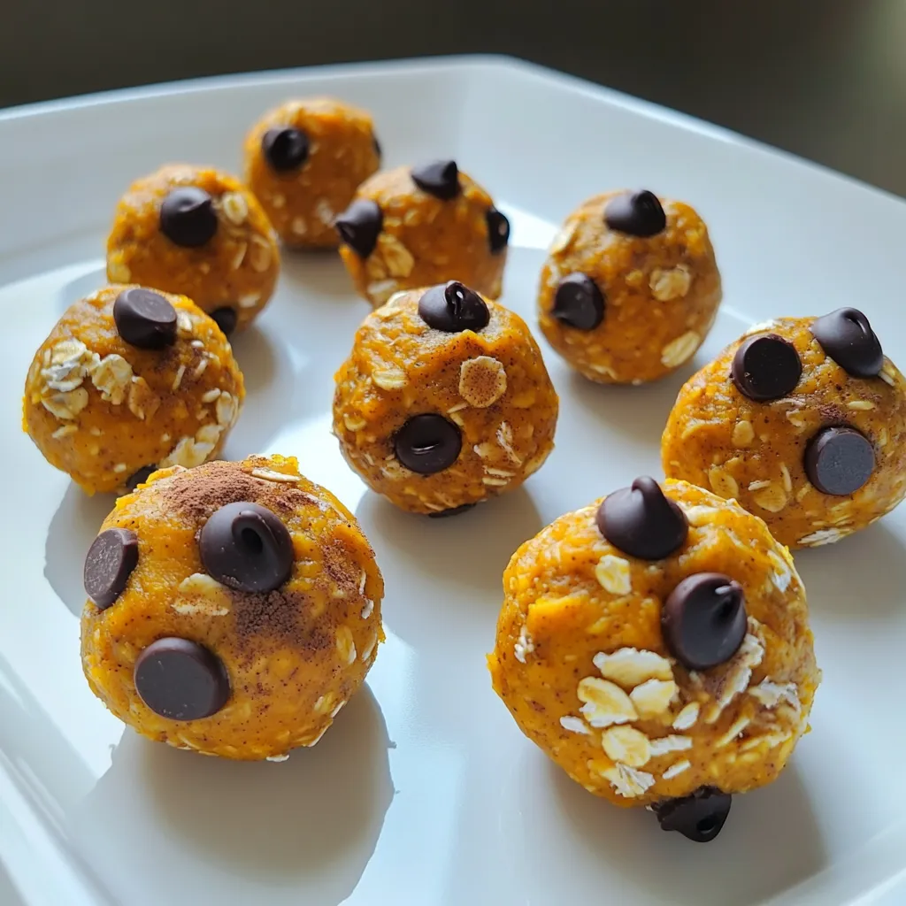 To make pumpkin protein energy balls, you will need: - 1 cup pumpkin puree - 1 cup rolled oats - 1/2 cup almond butter (or peanut butter) - 1/4 cup honey or maple syrup - 1/4 cup vanilla protein powder - 1/2 teaspoon cinnamon - 1/4 teaspoon nutmeg - 1/4 cup chocolate chips (dark or dairy-free) - Pinch of salt If you need substitutes, here are some good options: - Pumpkin puree: Use butternut squash puree if you can't find pumpkin. - Almond butter: Peanut butter works well if you have a nut allergy. - Honey: Maple syrup is a great vegan option. - Rolled oats: Use gluten-free oats for a gluten-free snack. - Protein powder: Try a plant-based protein powder for a vegan option. - Chocolate chips: Use dried fruit or seeds if you want a healthier mix. Each ingredient brings unique benefits to your energy balls: - Pumpkin puree: This is rich in vitamins A and C. It helps your immune system. - Rolled oats: Oats provide fiber, which keeps you full longer. - Almond butter: This nut butter gives healthy fats and protein, boosting energy. - Honey or maple syrup: Natural sweeteners add energy without refined sugar. - Vanilla protein powder: Adds protein for muscle repair and growth. - Cinnamon: This spice can help control blood sugar. - Nutmeg: It aids digestion and adds a warm flavor. - Chocolate chips: They add a touch of sweetness and antioxidants. - Salt: A pinch enhances flavor and helps balance electrolytes. Start by gathering your ingredients. You need: - 1 cup pumpkin puree - 1 cup rolled oats - 1/2 cup almond or peanut butter - 1/4 cup honey or maple syrup - 1/4 cup vanilla protein powder - 1/2 teaspoon cinnamon - 1/4 teaspoon nutmeg - 1/4 cup chocolate chips - Pinch of salt In a large bowl, combine the pumpkin puree, almond butter, and honey or maple syrup. Mix until smooth and blended well. Next, add the rolled oats, vanilla protein powder, cinnamon, nutmeg, and salt. Stir until all ingredients are mixed together. You want a thick, sticky mixture. Gently fold in the chocolate chips to add some sweetness. Now comes the fun part! With clean hands, scoop out about one tablespoon of the mixture. Roll it into a ball. Place each ball on a lined baking sheet. Make sure to leave space between each ball. Once you finish rolling all the mixture, place the baking sheet in the fridge. Chill the energy balls for at least 30 minutes. This step helps them firm up nicely. After chilling, your energy balls are ready to enjoy! They make a great snack, breakfast, or post-workout treat. You can grab one quickly when you’re in a hurry. If you have leftovers, store them in an airtight container in the fridge. They stay fresh for up to a week. Try them with a glass of milk or a piece of fruit for a balanced snack. To make your pumpkin protein energy balls just right, focus on the balance of wet and dry ingredients. The pumpkin puree adds moisture. Use just enough oats to help bind everything together. If the mixture is too dry, add a bit more almond butter. If it's too wet, add more oats. The spices, like cinnamon and nutmeg, give a warm flavor. Adjust these to fit your taste. A little more cinnamon can make a big difference. One common mistake is not mixing well. If you don’t blend the ingredients fully, some bites might taste bland. Make sure to mix until everything is well combined. Another mistake is not chilling the balls enough. Chilling helps them firm up, making them easier to handle. If you skip this step, they may fall apart. Finally, don’t skip the chocolate chips! They add sweetness and make the snack enjoyable. Use a large bowl for mixing. This gives you space to stir without making a mess. I find it best to use my hands to roll the balls. This way, you can feel the texture. Aim for about one tablespoon for each ball. This size is perfect for a quick snack. After rolling, place the balls on a lined baking sheet. Make sure they are not touching. This keeps them from sticking together while they chill. {{image_2}} You can change the taste of your energy balls easily. For a chocolate twist, use cocoa powder instead of some of the protein powder. If you want a fruity kick, add mashed ripe bananas or applesauce. Try using different nut butters like cashew or sunflower seed butter for unique flavors. You can also swap the pumpkin puree for sweet potato for a different taste. Making these energy balls fit your diet is simple. To make them vegan, swap honey for maple syrup. Check that your protein powder is plant-based. For gluten-free options, use gluten-free rolled oats. This way, everyone can enjoy these tasty snacks without worry. Adding seeds or dried fruits can boost nutrition and flavor. Consider mixing in chia seeds, flaxseeds, or sunflower seeds for crunch. Dried cranberries, raisins, or chopped apricots can add sweetness. These extras not only enhance taste but also add more fiber and healthy fats. Feel free to get creative and make these energy balls your own! To keep your pumpkin protein energy balls fresh, store them in an airtight container. This prevents air and moisture from spoiling them. Make sure the container is clean and dry before adding the energy balls. Place a piece of parchment paper between layers if you stack them. This helps avoid sticking. In the fridge, these energy balls last up to a week. They stay tasty and firm during this time. If you want to keep them longer, freeze them. In the freezer, they can last for about three months. Just remember to thaw them in the fridge before eating. Glass jars work well for storing energy balls. They are sturdy and do not absorb smells. Plastic containers are another option, but make sure they are BPA-free. Whichever container you choose, keep it sealed tight. This keeps your energy balls fresh and tasty for longer. Pumpkin protein energy balls stay fresh for about one week in the fridge. They need to be in an airtight container to keep them moist. If you want them longer, freeze them for up to three months. Just thaw them overnight before you eat. Yes, you can easily make these energy balls vegan. Just replace honey with maple syrup. Also, choose a plant-based protein powder. Use almond or peanut butter, as both are vegan-friendly. If you don’t have protein powder, you can use ground flaxseed or chia seeds. These add healthy fats and fiber. You might want to add a bit more almond butter to keep the texture right. Yes, you can freeze these energy balls. After rolling them, place them on a baking sheet. Freeze them for about one hour, then move them to a freezer bag. This keeps them from sticking together. Each energy ball contains about 100 calories. They have around 4 grams of protein and 5 grams of healthy fats. With pumpkin and oats, they are rich in fiber too. This makes them a great snack for energy and fullness. In this article, we explored pumpkin protein energy balls. We detailed ingredients, substitutes, and their health benefits. You learned step-by-step instructions for making and serving them. We also shared tips for perfecting texture and avoiding common mistakes. Variations allow you to customize these snacks for any diet. Lastly, we covered storage options to keep them fresh longer. Enjoy making these tasty, healthy treats. They are easy and fun to create!