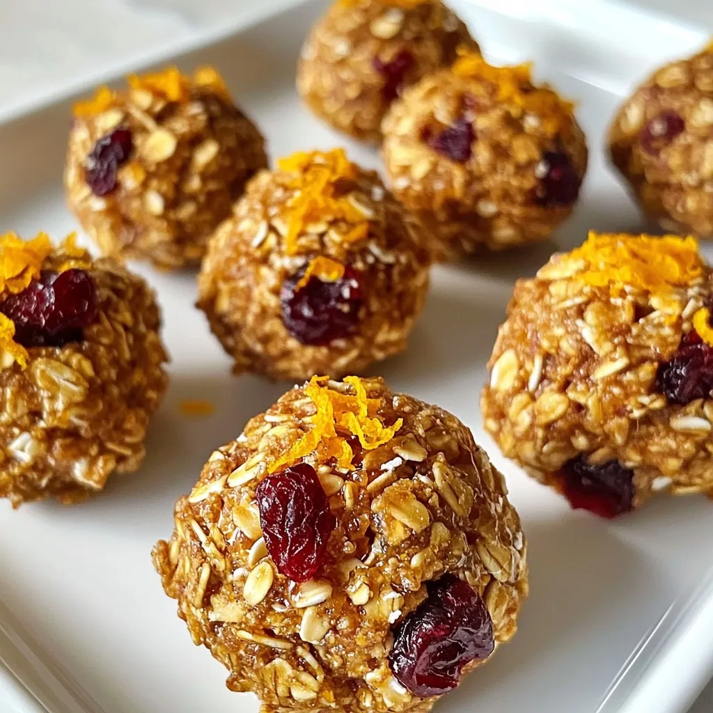 To make Cranberry Orange Energy Bites, you will need: - 1 cup rolled oats - ½ cup almond butter - ⅓ cup honey or maple syrup - ½ cup dried cranberries, chopped - Zest of 1 orange - 2 tablespoons fresh orange juice - ¼ cup ground flaxseed - 1 teaspoon vanilla extract - ¼ teaspoon salt - ¼ teaspoon cinnamon (optional) Each ingredient in these energy bites brings health benefits. Rolled oats provide fiber. Fiber helps with digestion and keeps you full longer. Almond butter offers protein and healthy fats. This helps fuel your body. Dried cranberries add sweetness and antioxidants. Antioxidants fight free radicals in your body. Ground flaxseed contains omega-3 fatty acids. These acids support heart health. Orange zest and juice give flavor and vitamin C. Vitamin C boosts your immune system. You can easily change some ingredients. For a nut-free option, use sunflower seed butter. If you want to go vegan, swap honey for maple syrup. You can also use any dried fruit you like. Raisins or apricots work great too. If you do not have ground flaxseed, try chia seeds instead. For a gluten-free version, ensure your oats are certified gluten-free. {{ingredient_image_1}} To make these Cranberry Orange Energy Bites, you only need 10 minutes. Gather your ingredients first. You will mix, roll, and chill. This simple process creates a tasty and healthy snack. Start with a large mixing bowl. Add 1 cup of rolled oats, ½ cup of almond butter, and ⅓ cup of honey or maple syrup. Mix these until they blend well. Then, add ½ cup of chopped dried cranberries, the zest of 1 orange, and 2 tablespoons of fresh orange juice. Sprinkle in ¼ cup of ground flaxseed, 1 teaspoon of vanilla extract, ¼ teaspoon of salt, and ¼ teaspoon of cinnamon if you like it. Stir everything together thoroughly. You might want to use your hands for this part. This helps the mixture stick together better. Once your mixture is ready, it’s time to roll. Take about 1 tablespoon of the mixture and roll it into a ball with your hands. Keep doing this until you use up all the mixture. Place the small balls on a baking sheet lined with parchment paper. Now, you need to chill them. Put the baking sheet in the fridge for at least 30 minutes. This helps the bites firm up nicely. After chilling, store them in an airtight container. They will stay fresh for up to a week in the fridge. Enjoy your tasty energy bites! To make the best cranberry orange energy bites, start with a large bowl. Combine rolled oats, almond butter, and honey (or maple syrup). Mix these ingredients well until you see no dry oats. Then, add dried cranberries, orange zest, orange juice, and flaxseed. Include vanilla extract, salt, and cinnamon if you like. Use your hands to mix. This helps all ingredients stick together well. Store your energy bites in an airtight container. Keep them in the fridge for up to one week. If you want to keep them longer, freeze them. Place bites in a single layer on a tray. After they freeze, transfer them to a container. They can last for about three months in the freezer. These energy bites are perfect for any time of day. Enjoy them as a snack before or after workouts. You can also have them as a quick breakfast. Serve them with yogurt or fresh fruit for a tasty treat. For a fun twist, try drizzling a little extra honey on top before serving. Pro Tips Use Fresh Ingredients: Fresh orange juice and zest can enhance the flavor of these energy bites significantly, making them taste vibrant and fresh. Customize Your Mix-ins: Feel free to swap out dried cranberries for other dried fruits like apricots or cherries, or add some nuts or seeds for extra crunch and nutrition. Chill for Better Texture: Refrigerating the energy bites helps them firm up, making them easier to handle and giving them a better texture. Perfect Storage: Store the energy bites in an airtight container in the refrigerator to keep them fresh for up to a week, or freeze them for longer storage. {{image_2}} You can easily change the flavor of your energy bites. If you love chocolate, add cocoa powder. Just two tablespoons will do. It gives the bites a nice chocolate taste. For a nut-free option, swap almond butter for sunflower seed butter. This keeps the bites safe for kids with nut allergies. You can also use pumpkin seeds for a unique twist. Feel free to play with the nut butters. You can use peanut butter instead of almond butter. This gives a different taste. If you want a sugar-free option, try using mashed bananas. They add sweetness and moisture. For sweeteners, maple syrup works well too. You can even use agave nectar if you have it on hand. You can switch dried cranberries with fresh fruit based on the season. In summer, try using fresh blueberries or strawberries. In fall, use chopped apples or pears. This keeps the energy bites fresh and fun. Fresh fruits also add a burst of flavor and extra nutrients. Just make sure to adjust the moisture in the mix if you're using fresh fruit. To keep your Cranberry Orange Energy Bites fresh, use an airtight container. This helps maintain their texture and taste. Store them in the refrigerator for up to one week. If you want to enjoy them longer, freezing is a great option. To freeze your energy bites, first, let them chill in the fridge. Once firm, place them in a single layer on a baking sheet. Freeze them for about an hour. After that, transfer them to a freezer-safe bag or container. They can last up to three months in the freezer. When you want to eat them, just thaw in the fridge overnight. Always check for any signs of spoilage. If the bites smell off or have a strange texture, it's best to toss them. Using fresh ingredients helps keep the energy bites tasty and nutritious. Dried cranberries should be stored in a cool, dry place to maintain quality. Following these tips ensures you enjoy your energy bites at their best! Yes, you can use quick oats. They will work in this recipe. However, quick oats may change the texture. Rolled oats give a chewier bite. If you like a softer texture, choose quick oats. For a heartier feel, stick with rolled oats. These energy bites can last up to one week in the fridge. Store them in an airtight container. If you want them to last longer, you can freeze them. They freeze well for up to three months. Just thaw them in the fridge when you want to eat them. Yes, you can easily make these bites vegan. Substitute honey with maple syrup or agave nectar. Both options add sweetness without any animal products. The rest of the ingredients in the recipe are already vegan-friendly. Enjoy a tasty snack with no animal ingredients! We explored the best ingredients and methods for making energy bites. With key ingredients that boost health and tasty variations, you can customize each batch. I also shared important tips for mixing, storing, and serving. Energy bites are great for quick snacks on the go. Remember to store them well to keep them fresh. Enjoy experimenting to make them your own and keep your energy up!